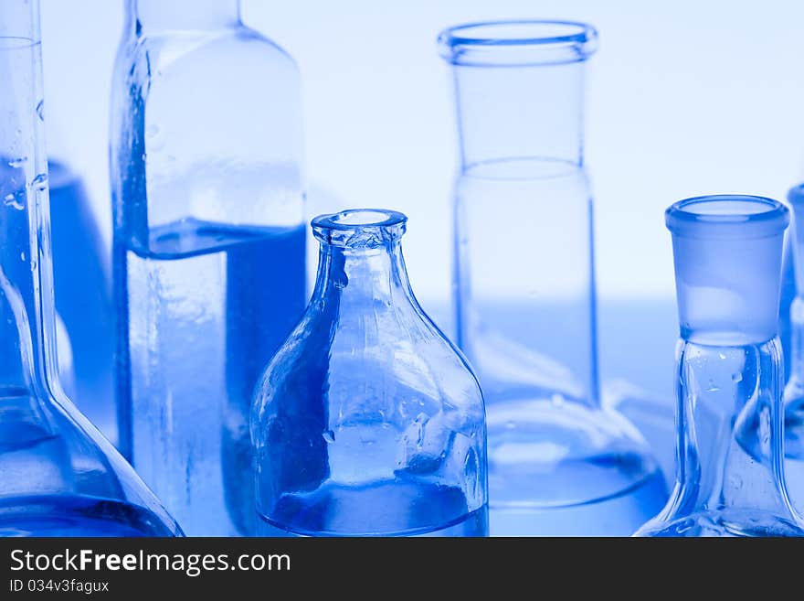 Laboratory glass. Glassware on the blue background.