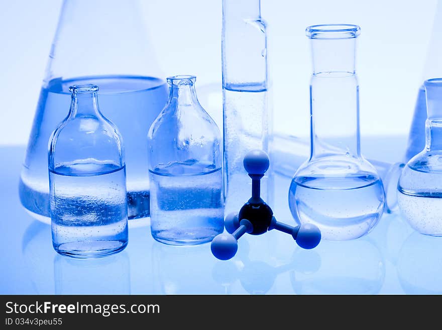 Laboratory glass. Glassware on the blue background.