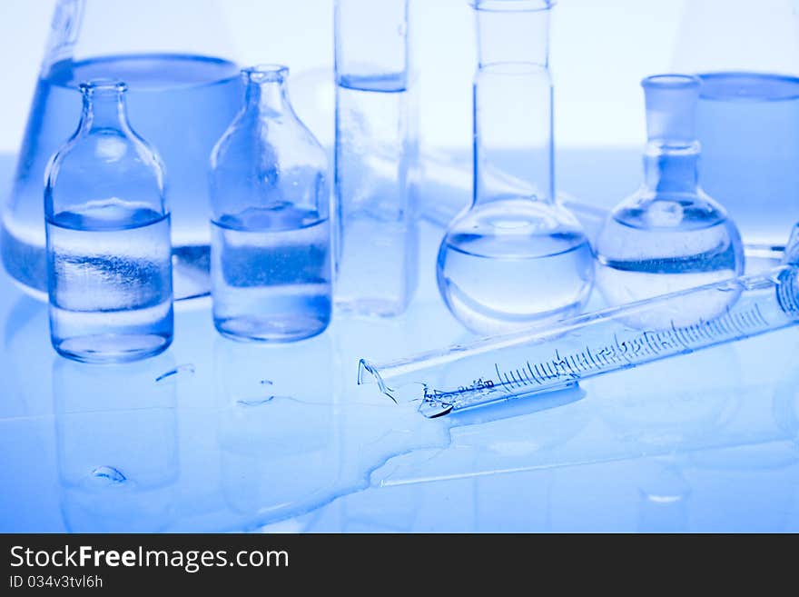 Laboratory glass. Glassware on the blue background.