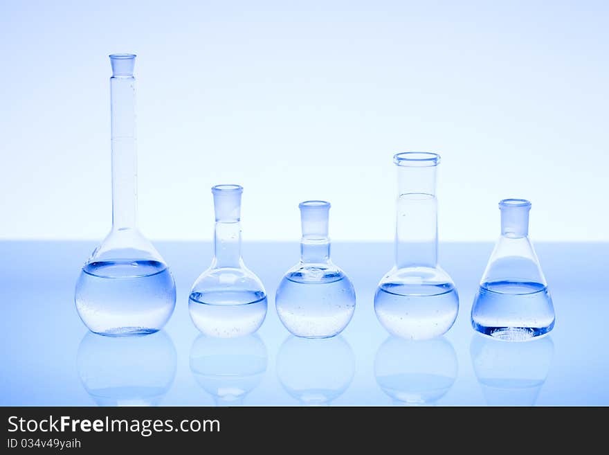 Laboratory glass. Glassware on the blue background.