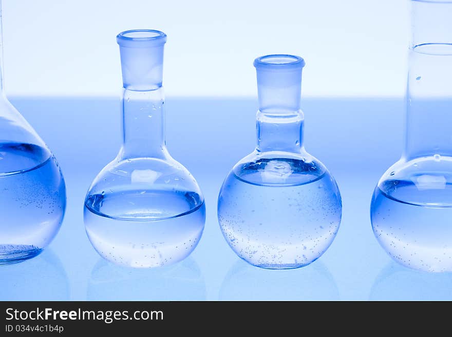 Laboratory glass. Glassware on the blue background.