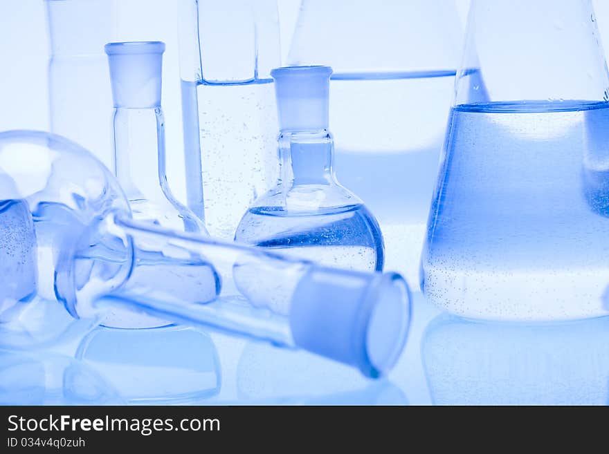 Laboratory glass. Glassware on the blue background.