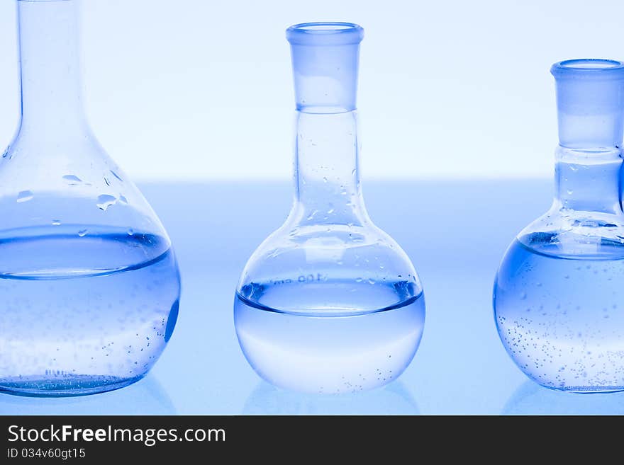 Laboratory glass. Glassware on the blue background.