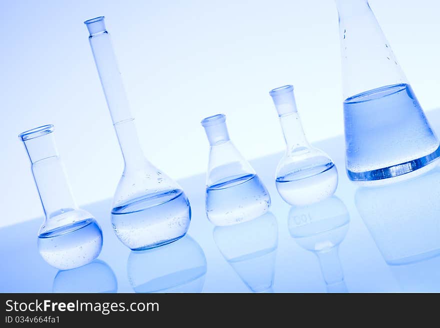 Laboratory glass. Glassware on the blue background.