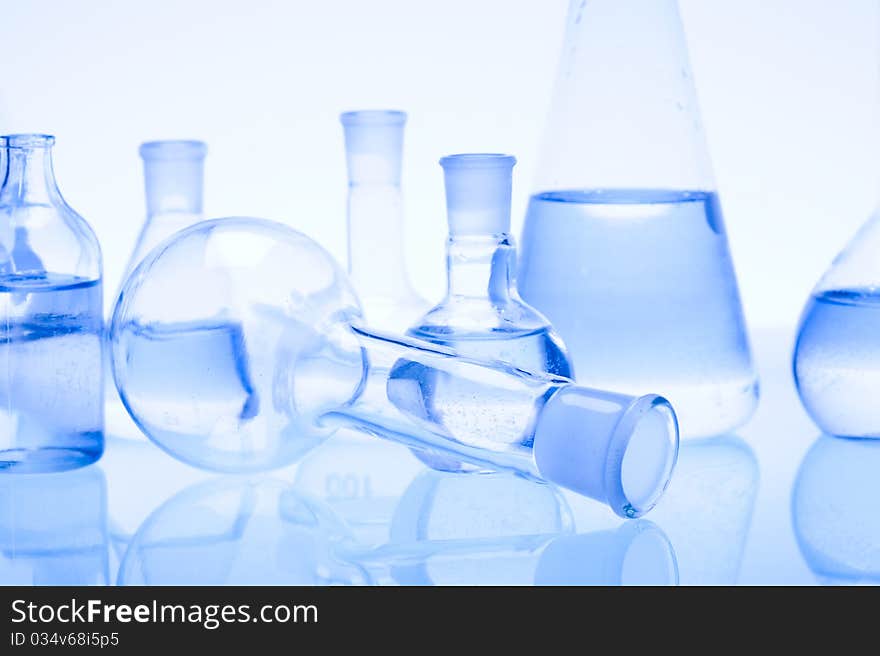 Laboratory glass. Glassware on the blue background.