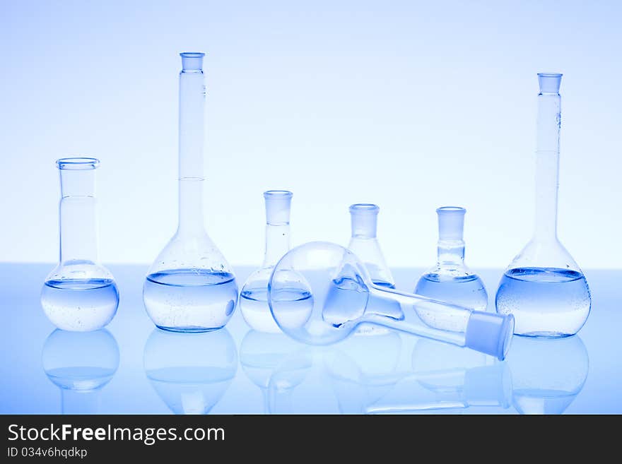 Laboratory glass. Glassware on the blue background.