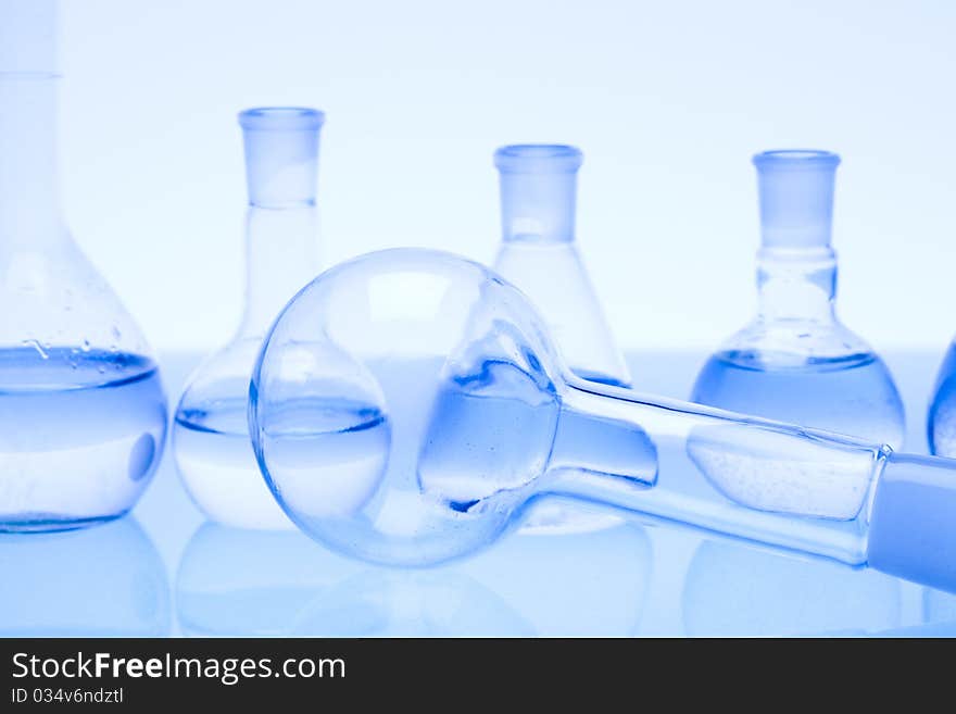 Laboratory glass. Glassware on the blue background.