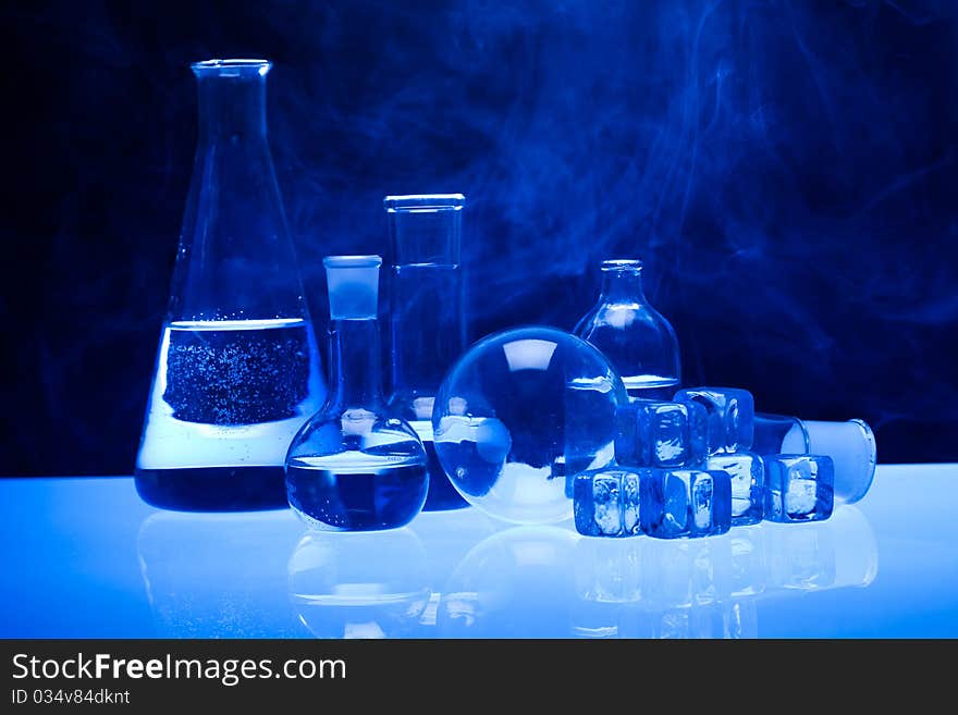 Laboratory glass. Glassware on the blue background.