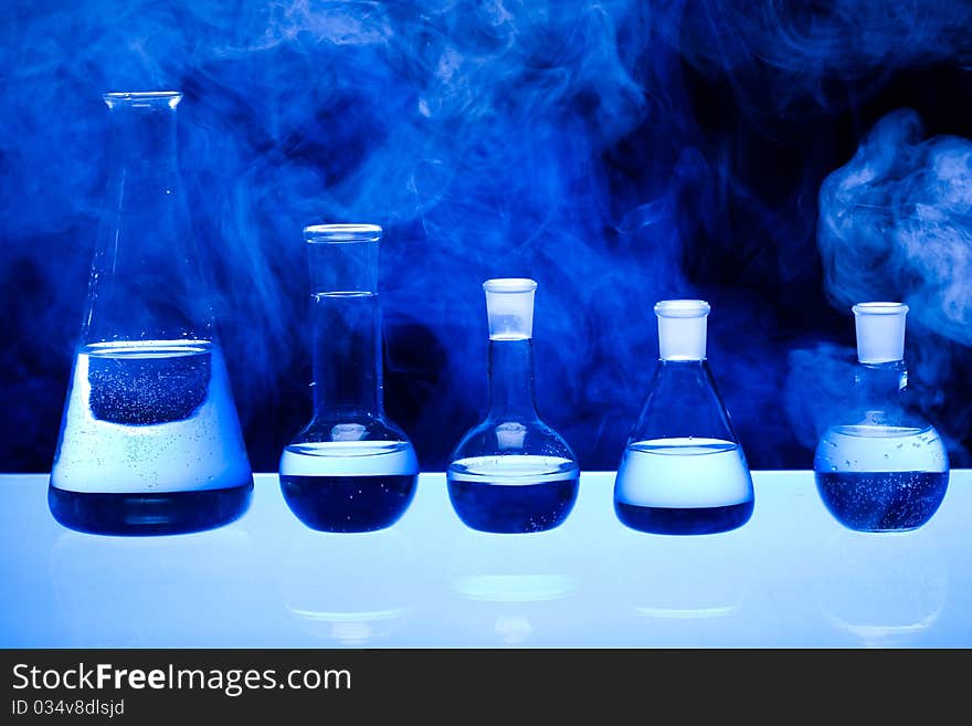 Laboratory glass. Glassware on the blue background.