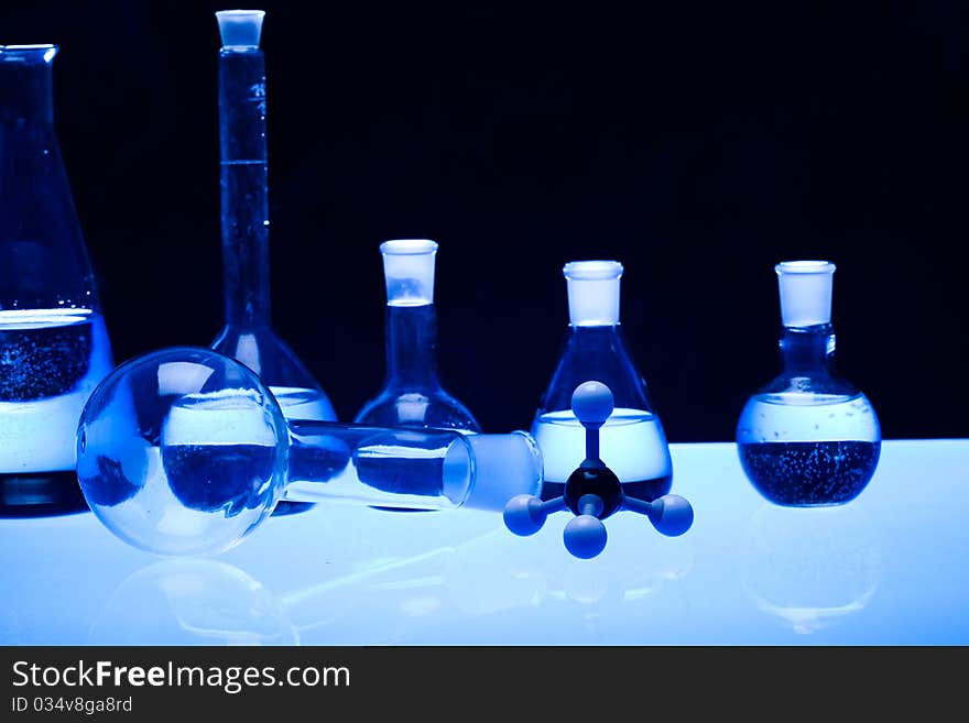 Laboratory glass. Glassware on the blue background.