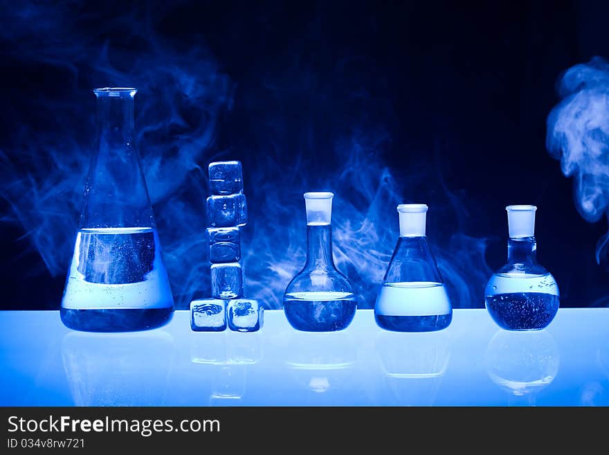 Laboratory glass. Glassware on the blue background.