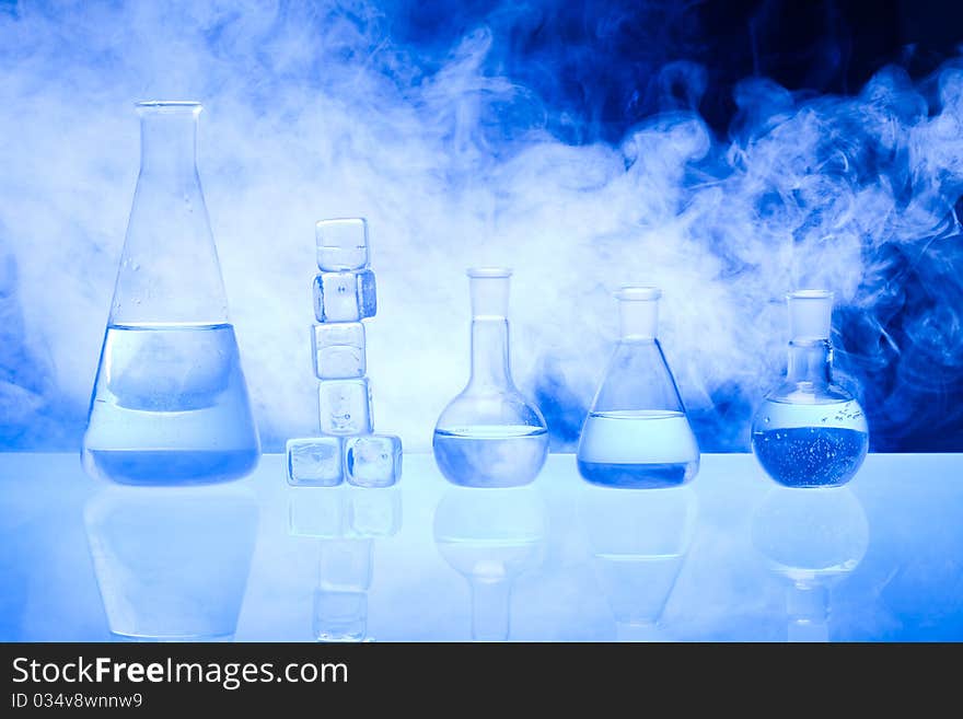 Laboratory glass. Glassware on the blue background.