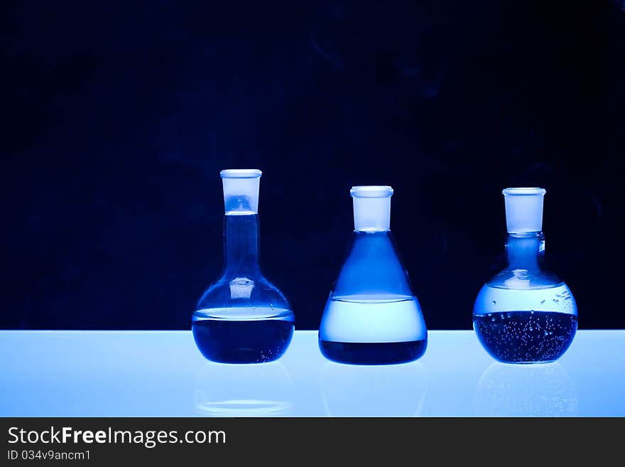 Laboratory glass. Glassware on the blue background.