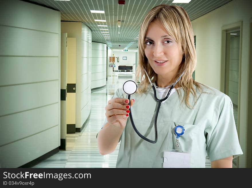 Smiling confident medical staff standing in her uniform. Smiling confident medical staff standing in her uniform