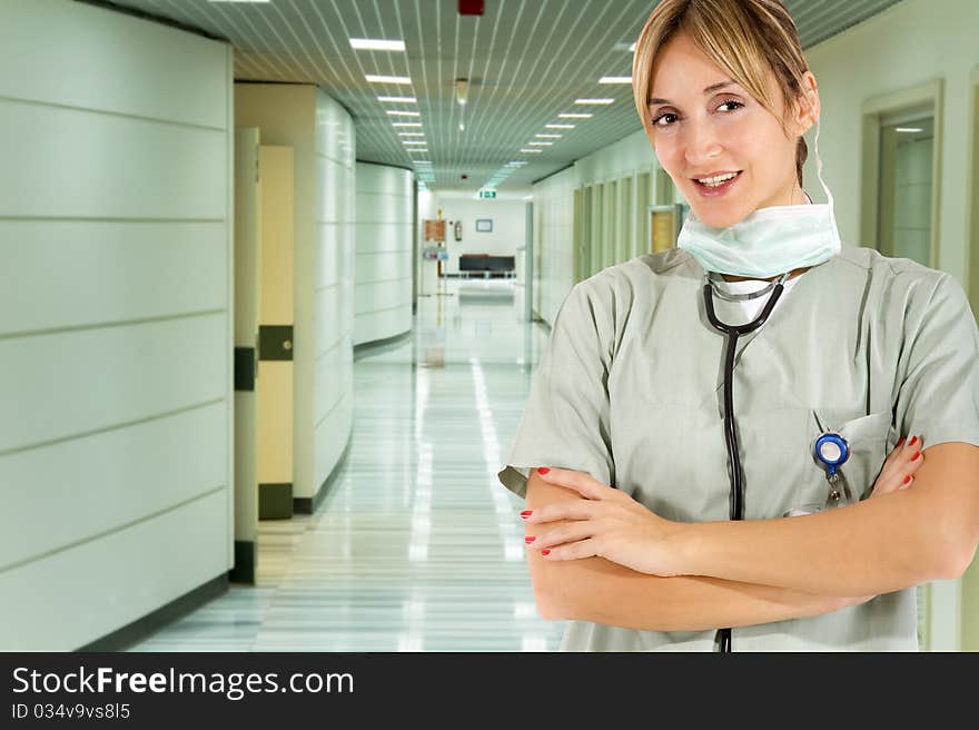 Smiling confident medical staff standing in her uniform. Smiling confident medical staff standing in her uniform