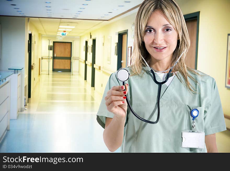 Smiling confident medical staff standing in her uniform. Smiling confident medical staff standing in her uniform