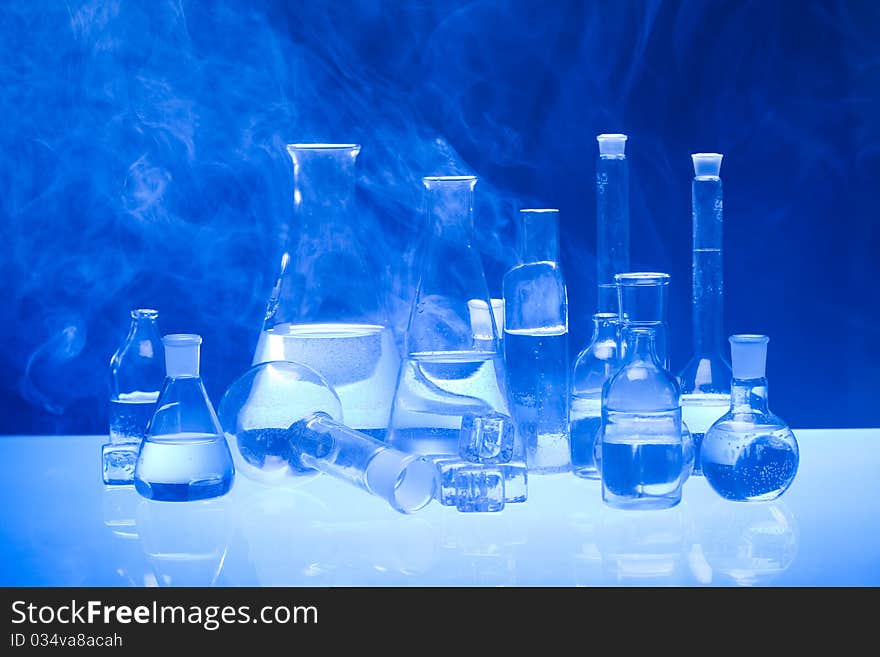 Laboratory glass. Glassware on the blue background.