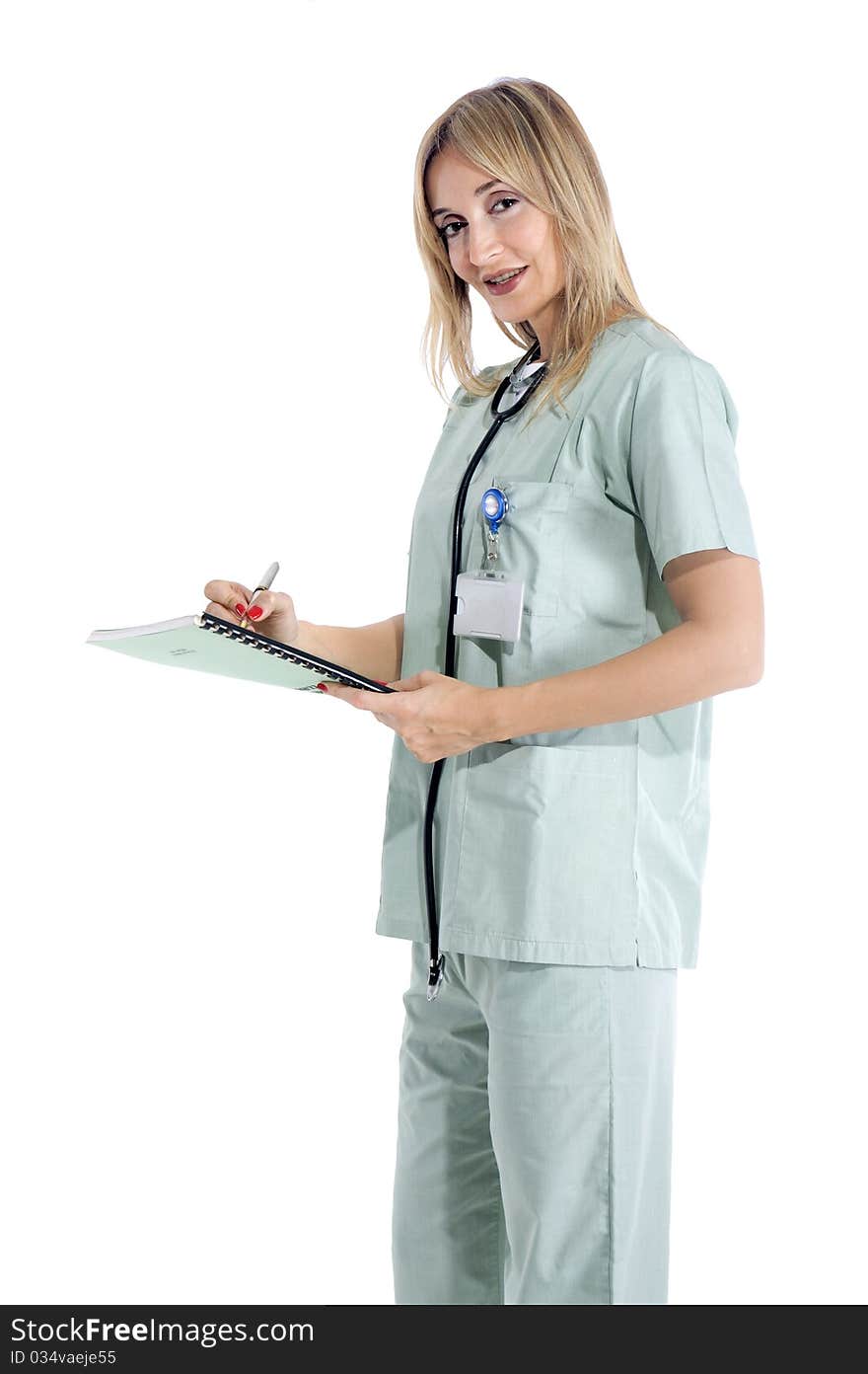 Smiling confident medical staff standing in her uniform. Smiling confident medical staff standing in her uniform