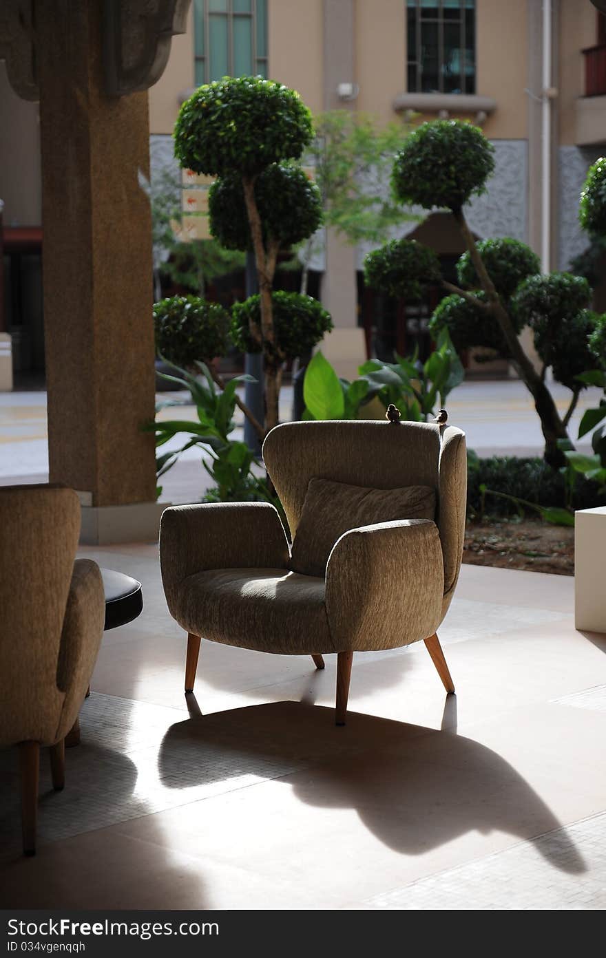 A relaxation corner in hotel,with comfortable sofa,and two bird on the sofa. A relaxation corner in hotel,with comfortable sofa,and two bird on the sofa.