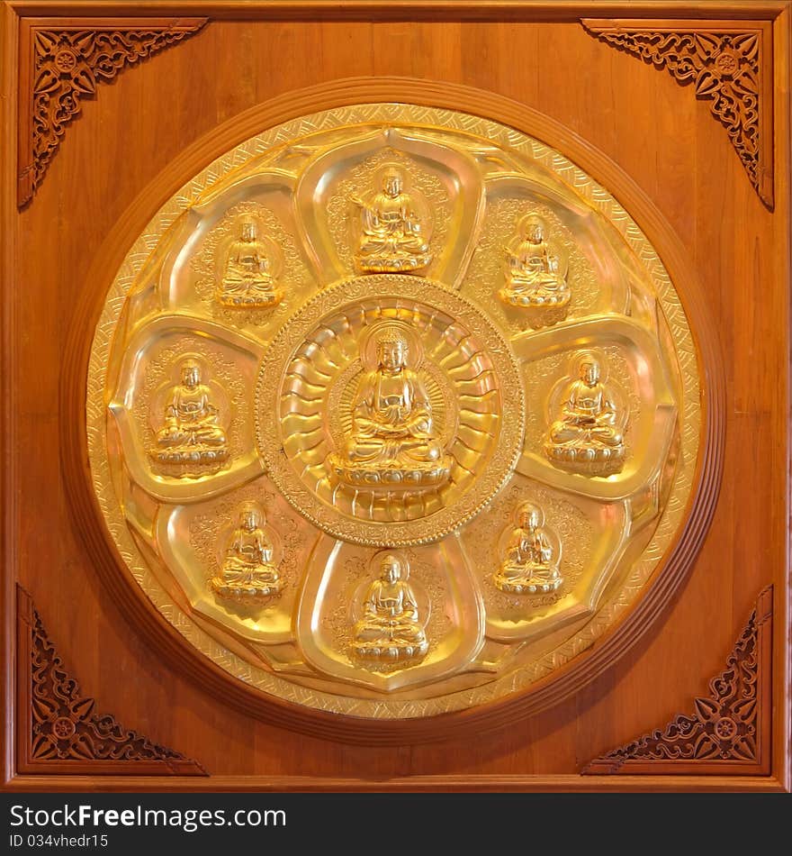 Image of golden Buddha in Chinese temple wall