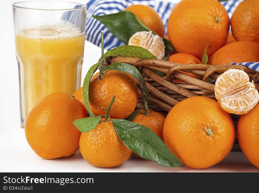 Fresh orange juice and just-picked oranges, Tangerine. Fresh orange juice and just-picked oranges, Tangerine