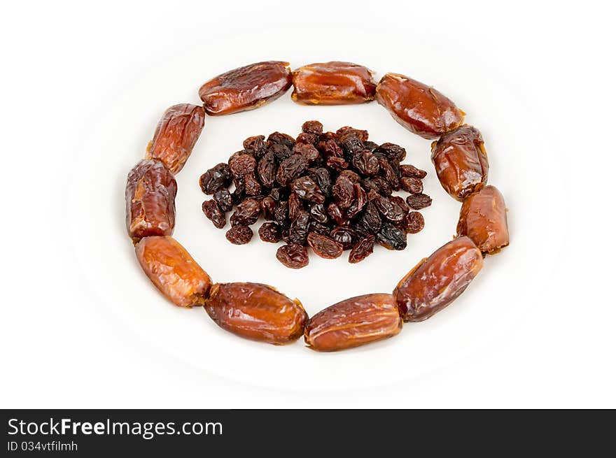 Pile of raisins inside a circle of dates. Pile of raisins inside a circle of dates