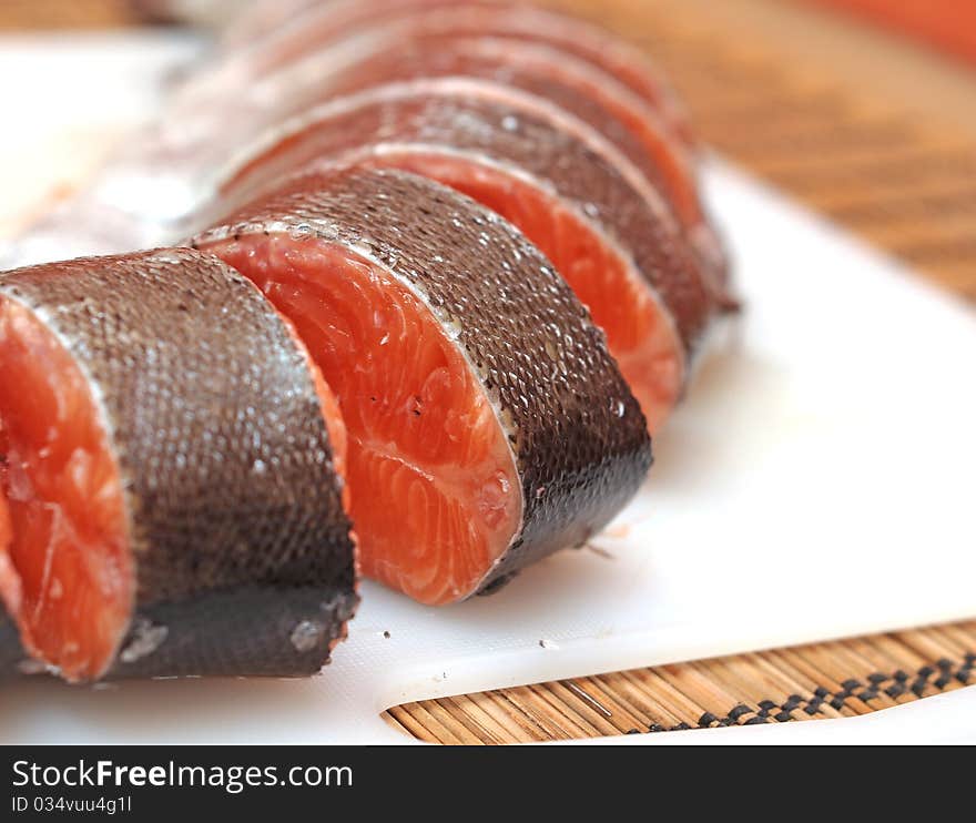 Sliced trout on a board. Sliced trout on a board