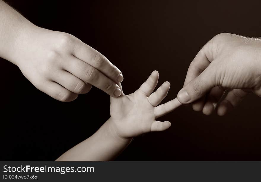 Hands of son and father