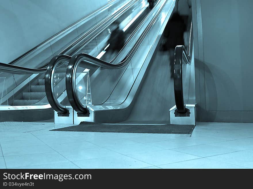 Moving metro escalator with passengers. Moving metro escalator with passengers