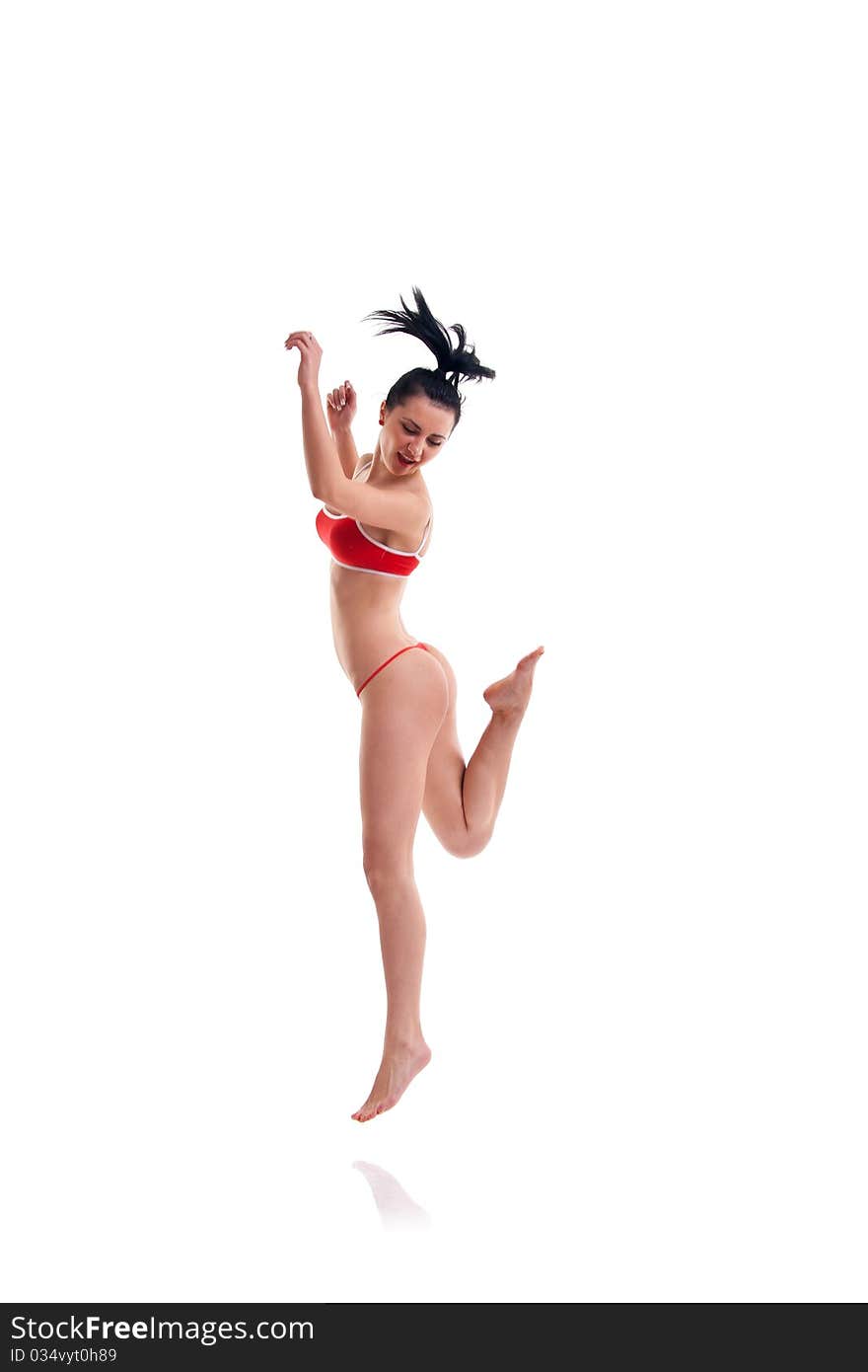 The beautiful young woman in a jump on a white background