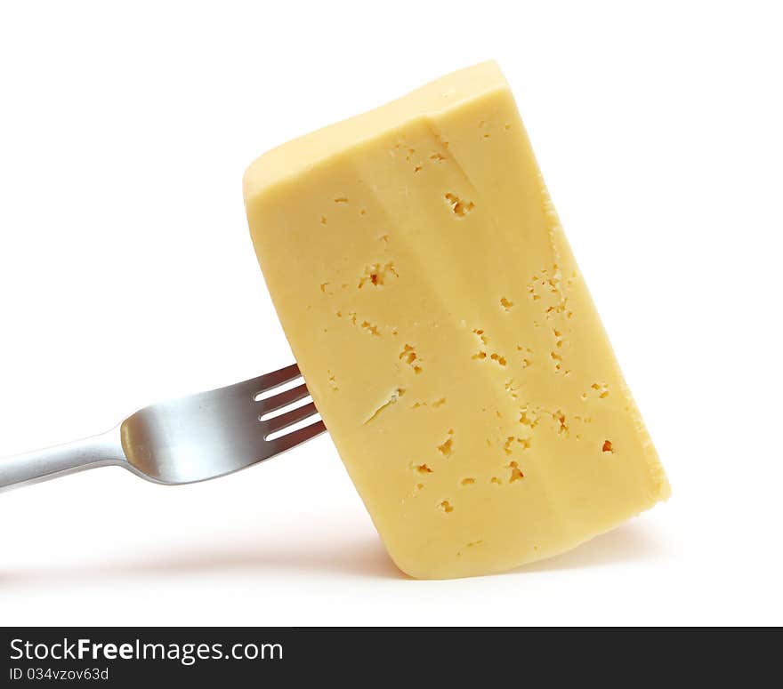 Cheese on fork isolated on white