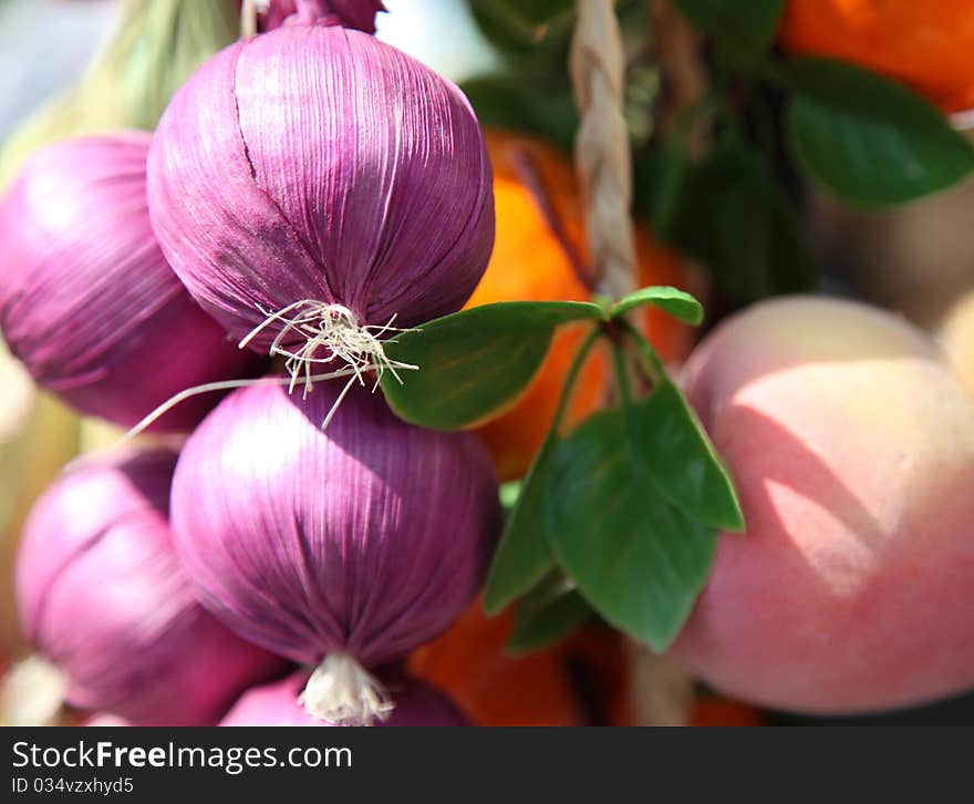 Artificial onions and other fruits as decoration. Artificial onions and other fruits as decoration