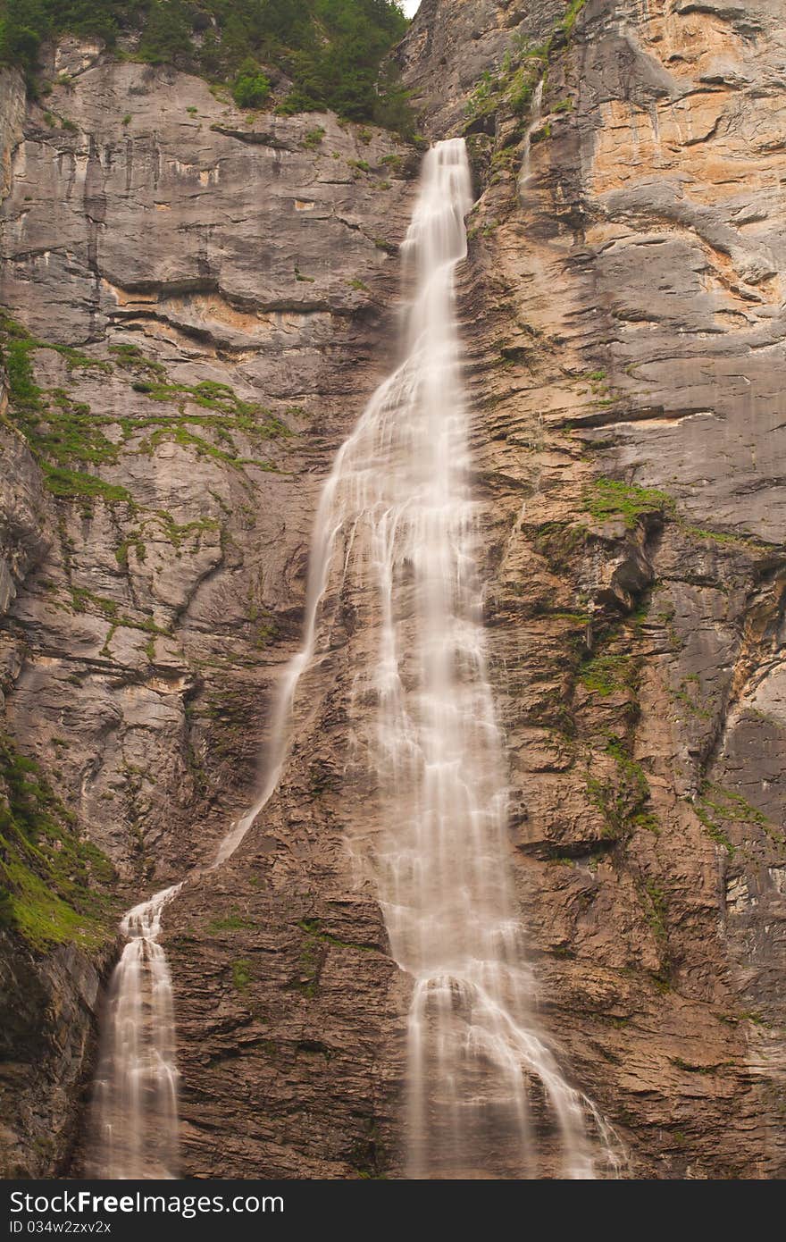 Small waterfall with brown rocks near Lauterbrunnen. Small waterfall with brown rocks near Lauterbrunnen