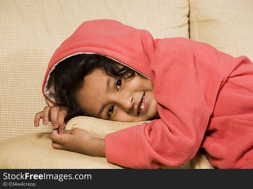 Cute little girl enjoying her winter hood. Cute little girl enjoying her winter hood.