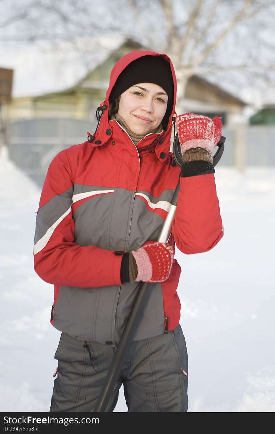 The girl in a red jacket and mittens