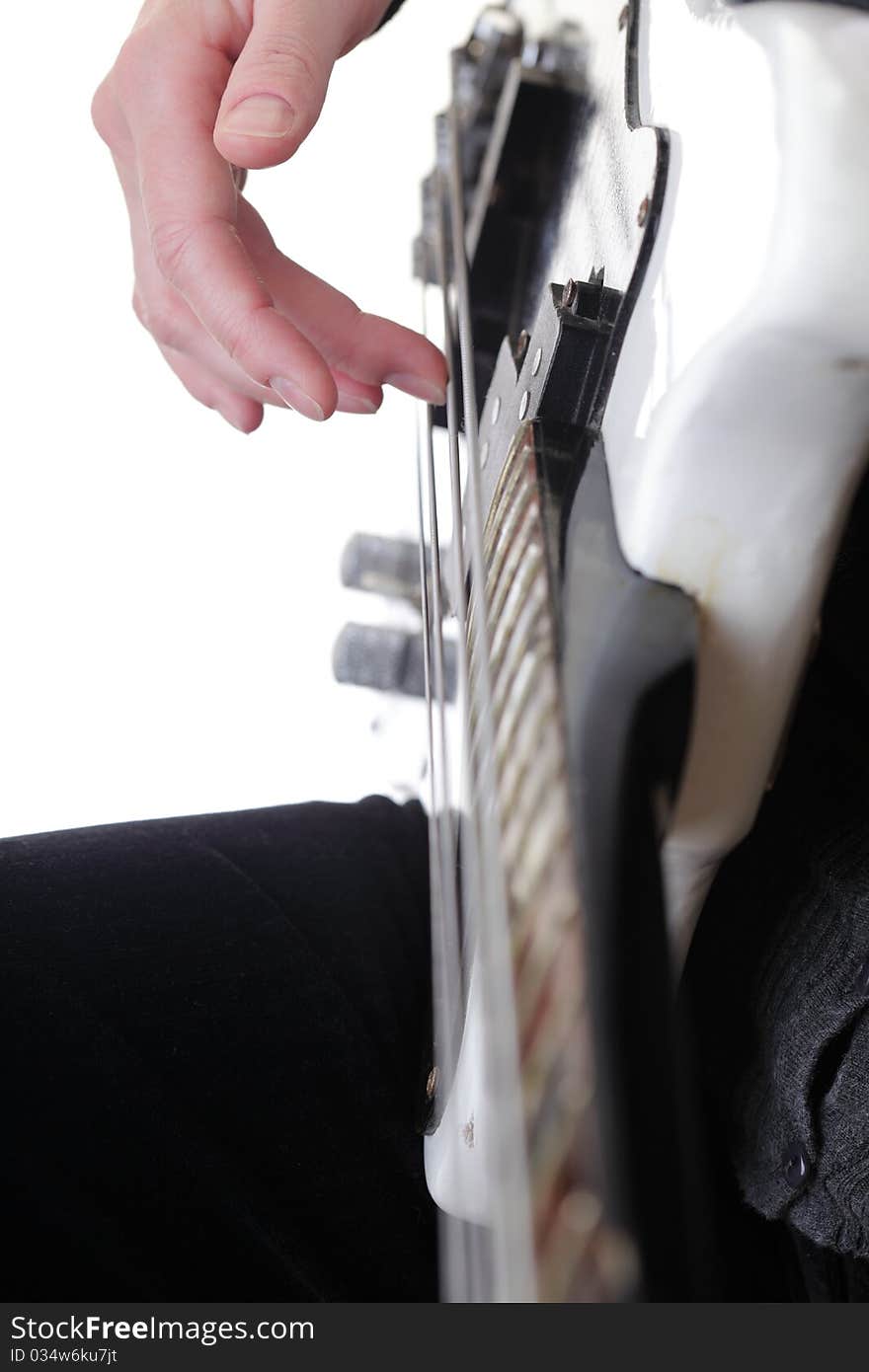 Playing electrical bass guitar isolated on white