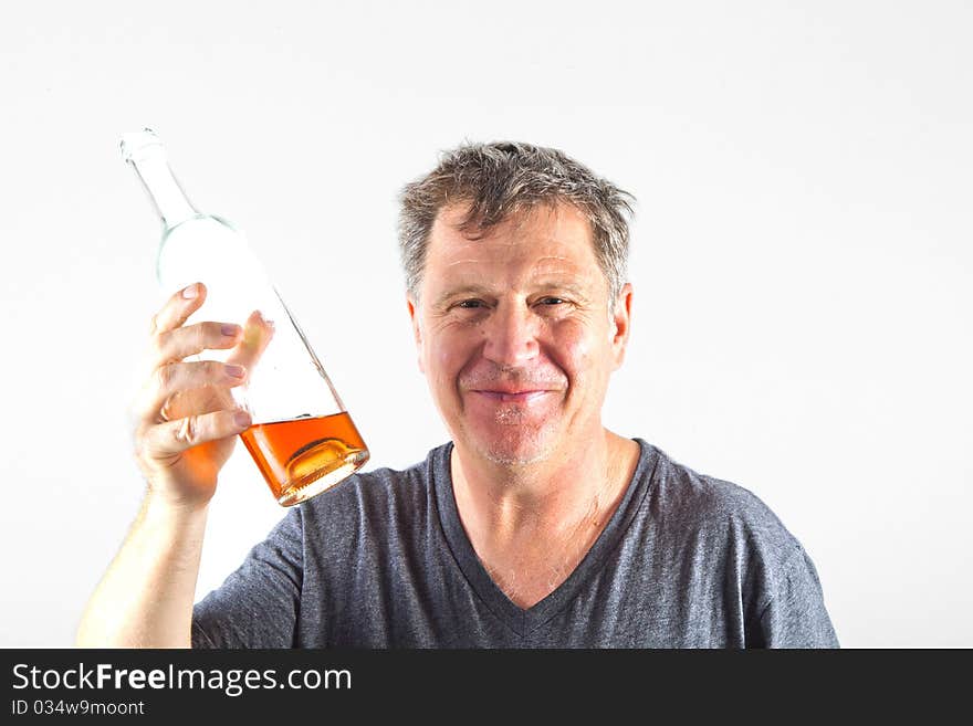 Man drinking alcohol out of a bottle