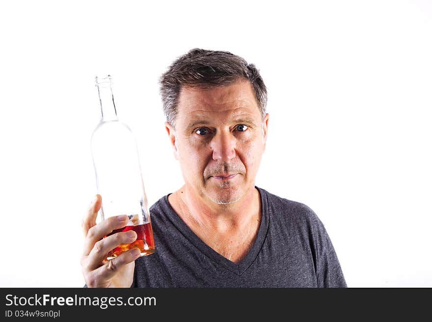 Man drinking alcohol out of a bottle