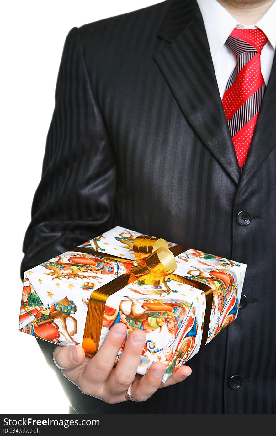 The businessman in a black suit has control over a celebratory gift. The businessman in a black suit has control over a celebratory gift