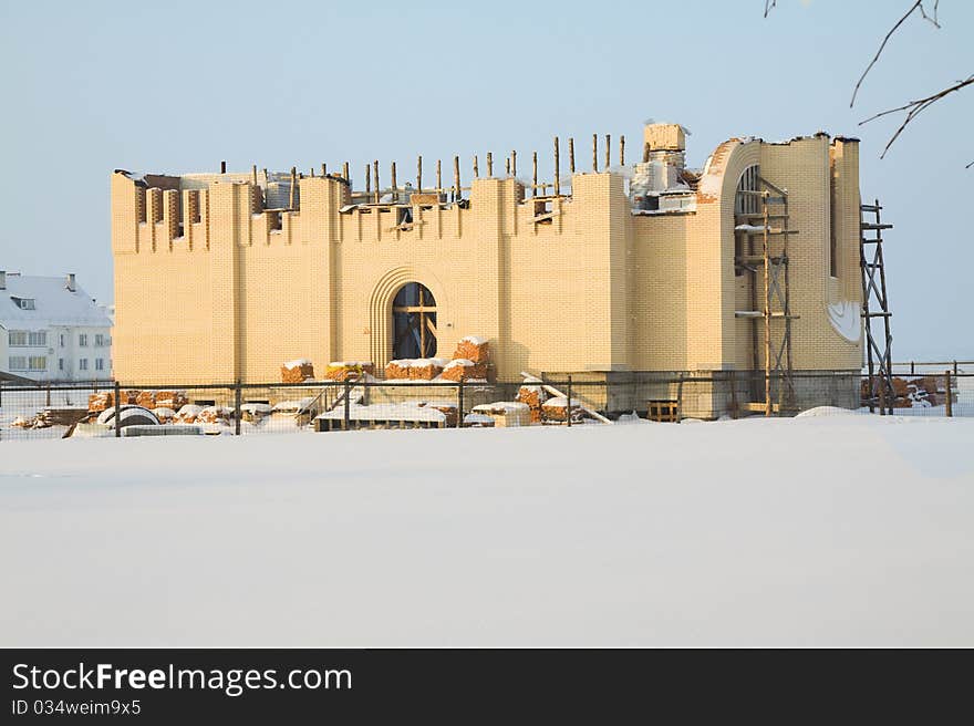 Building of a new religious structure (church) in winter time. Building of a new religious structure (church) in winter time