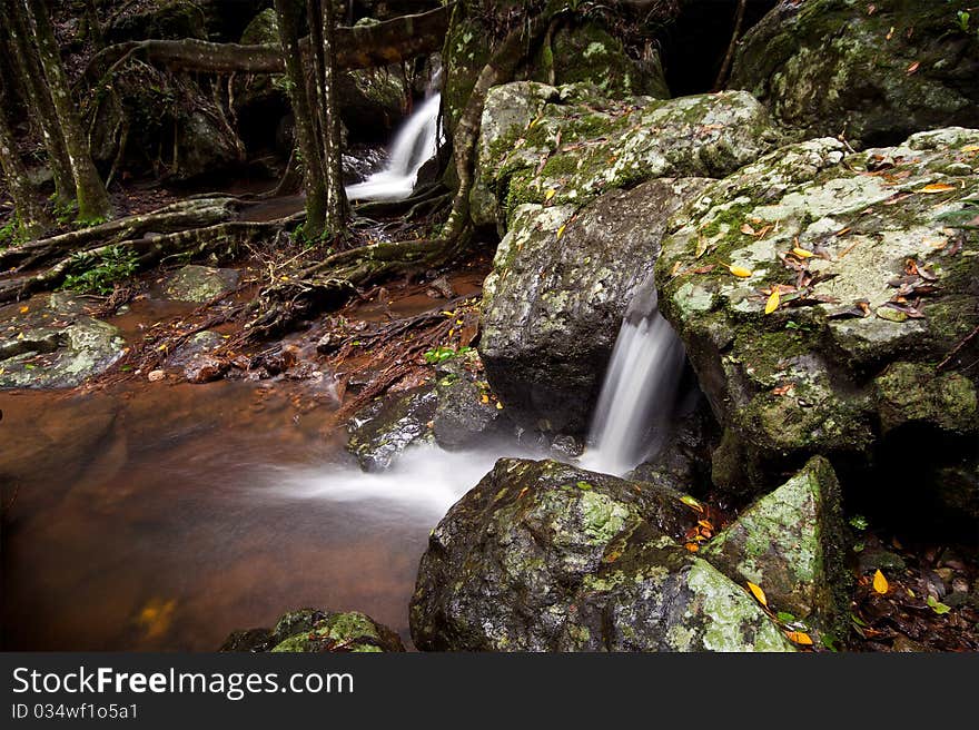 Cascades in australian rain forest with rocks