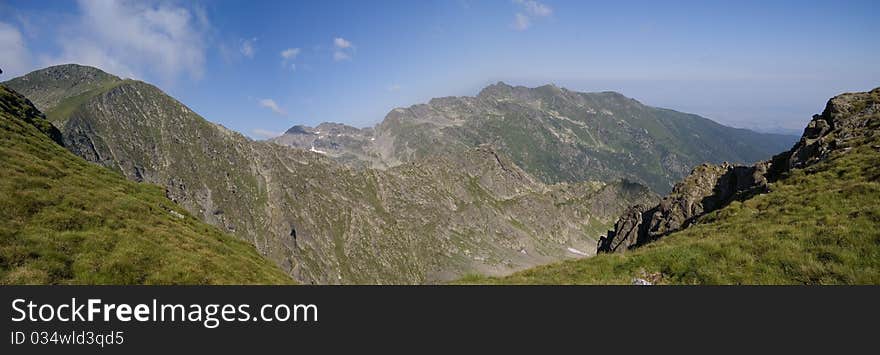 Carpathian Mountains. In background you can see Negoiu Peak on the right side and Lespezi Peak on the left side. Carpathian Mountains. In background you can see Negoiu Peak on the right side and Lespezi Peak on the left side.