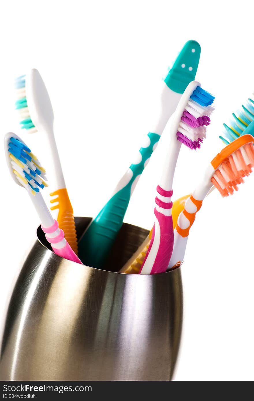 Toothbrushes In Metal Cup