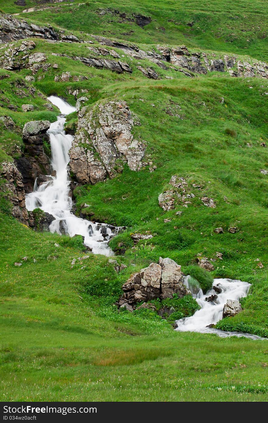 Waterfall in green alps mountains, near Grindelwald. Waterfall in green alps mountains, near Grindelwald