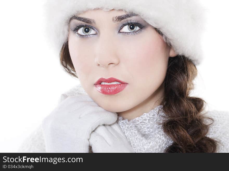 Close-up portrait of beautiful pure young woman wearing winter clothing