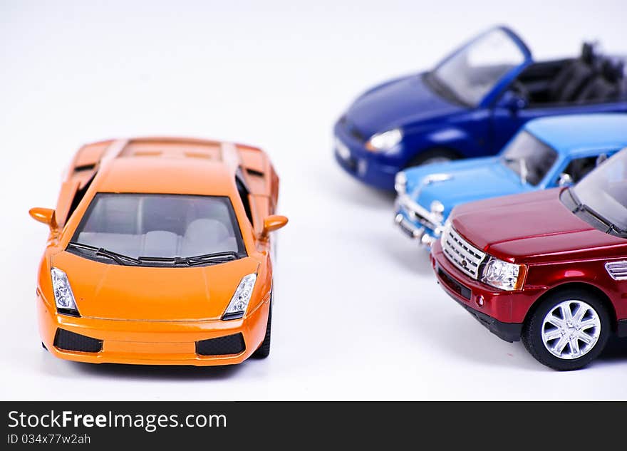 Colored car models on white background