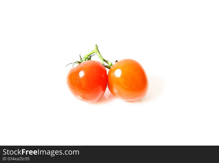 There are some small tomatoes, isolated on white background, took in a studio. There are some small tomatoes, isolated on white background, took in a studio.