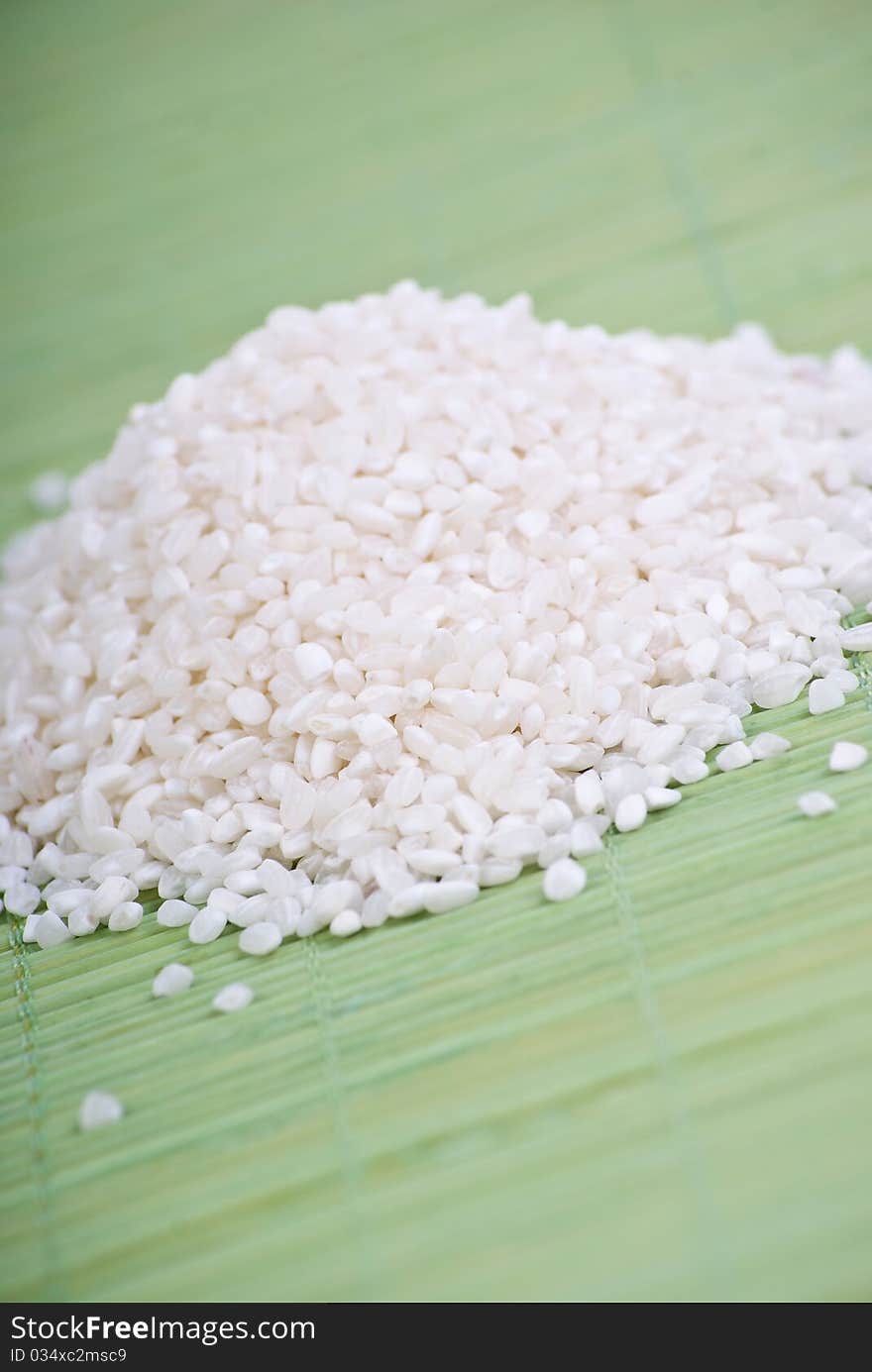 White rice on green background