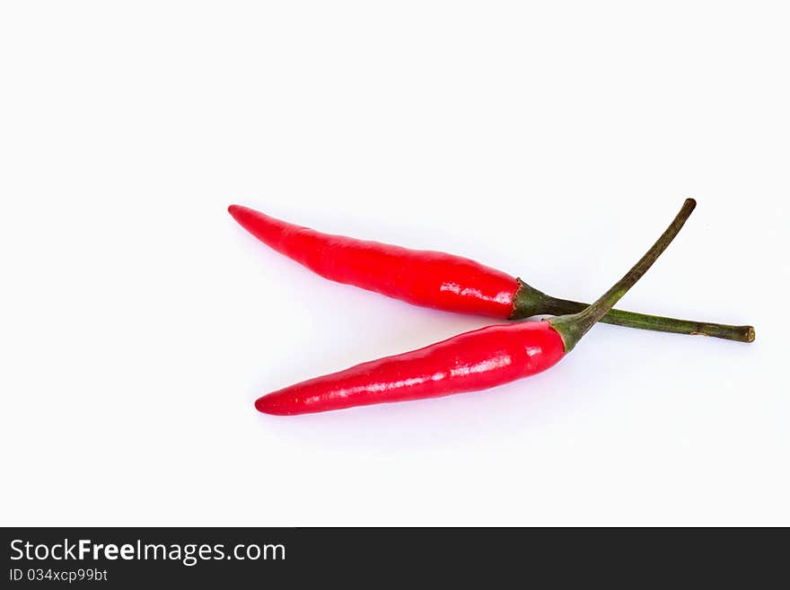 Red hot chili peppers on white background