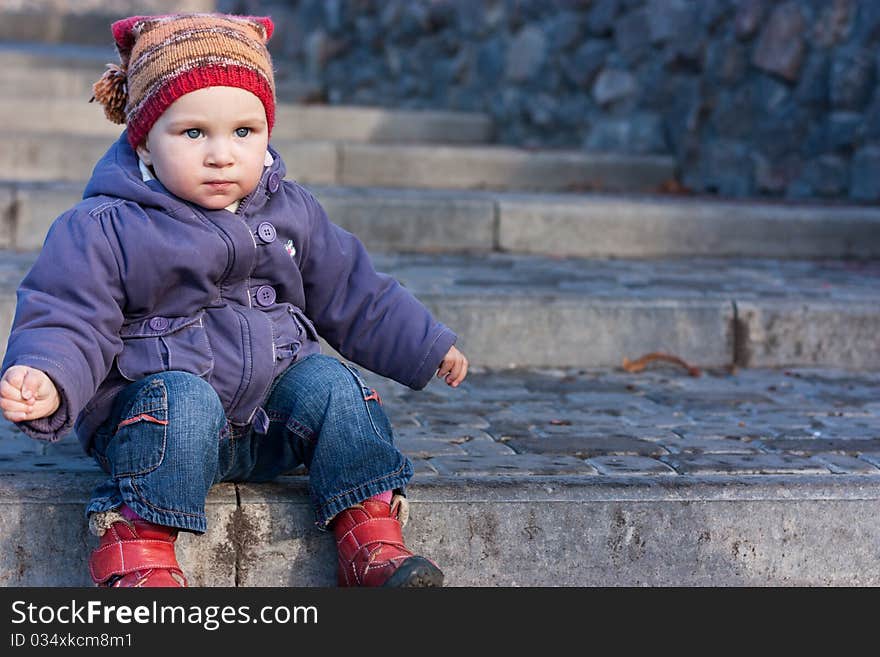 Beautiful Baby Sitting On Stairs